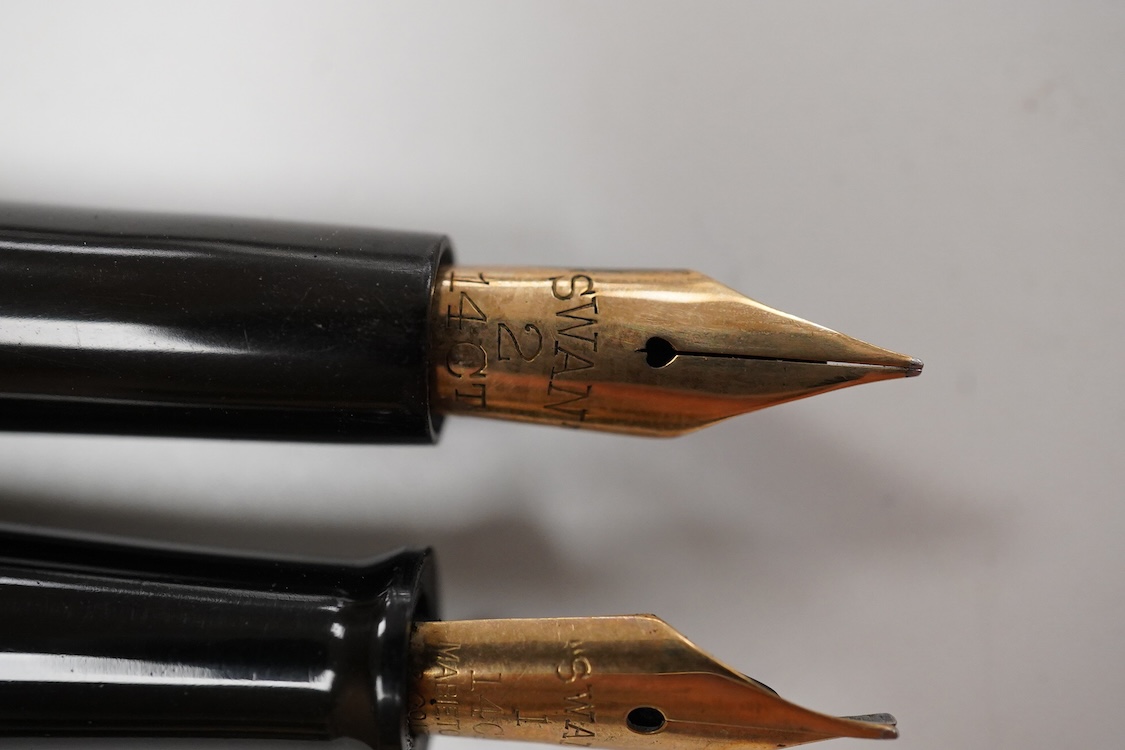 A Swan MT & Co. sterling silver filigree eyedropper along with similar gold filled example